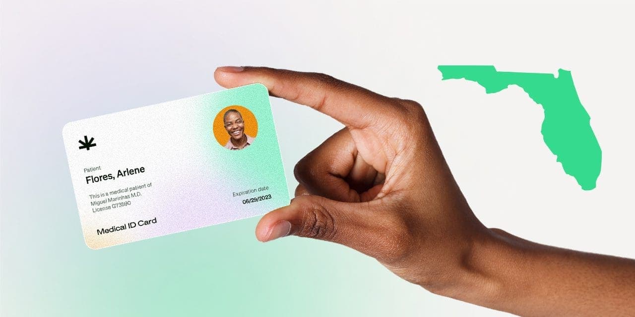 closeup hand holding MMJ card