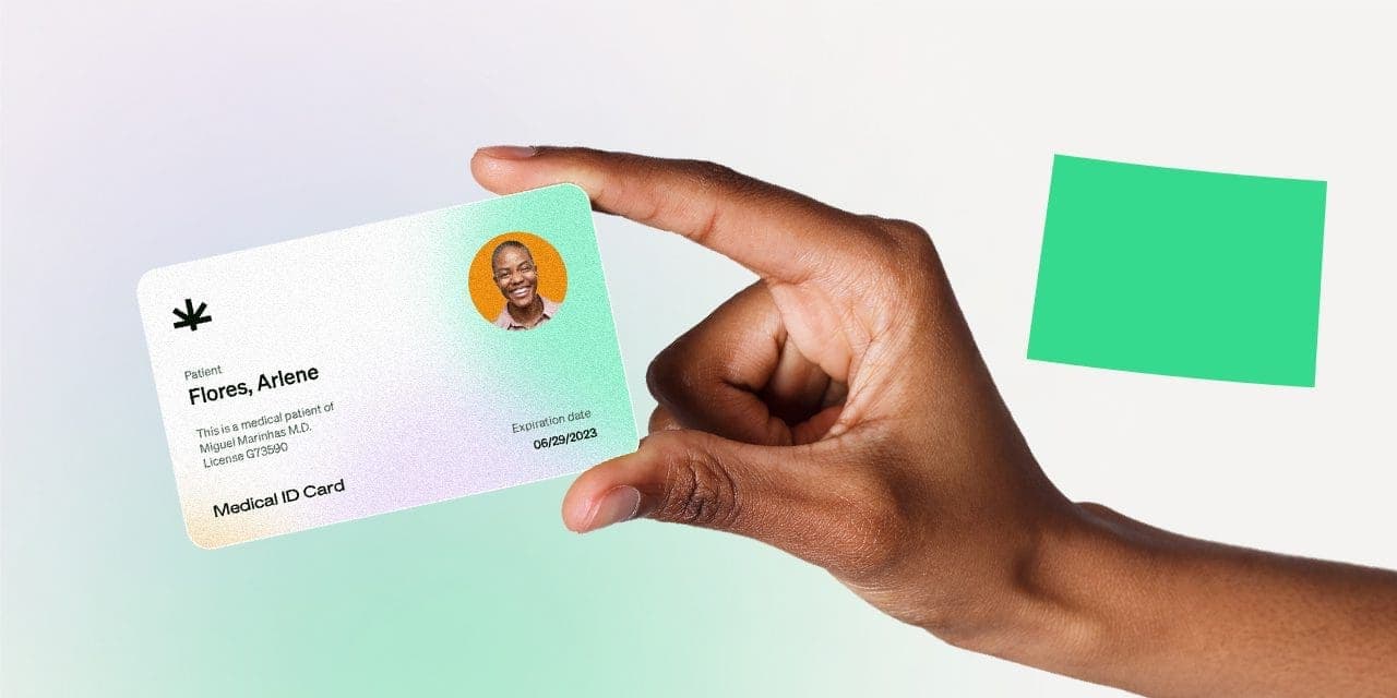 closeup hand holding MMJ card